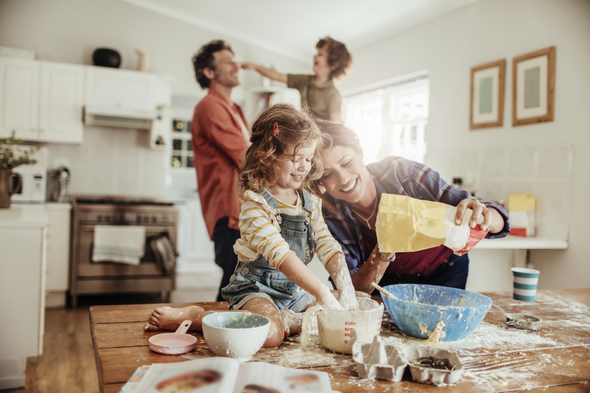 Close up of a young family baking together